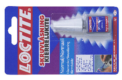 Förpackning av Loctite skruvlåsning, innehållande en liten flaska med etikett och blå plastbakgrund.