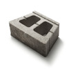 Betongmurblock med två stora rektangulära hål, grå yta och skrovlig textur.