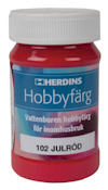 Röd flaska med vit skruvkork och etikett som visar texten "Herdins Hobbyfärg, 102 Julröd, Vattenburen hobbyfärg för inomhusbruk".