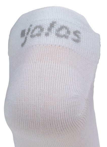 En vit strumpa med grå text som delvis visar ordet "joras" överst.