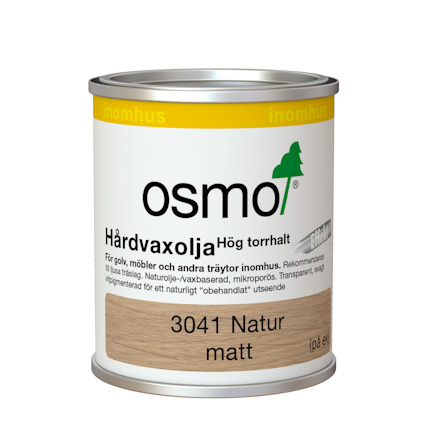 Plåtburk med Osmo hårdvaxolja, etikett innehåller text om produktens användning för inomhus träytor, med fokus på trägolv och möbler.