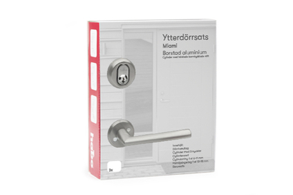 Förpackning med ytterdörrsats av borstat aluminium och dörrhandtag. Text: "Ytterdörrsats Miami Borstat aluminium".