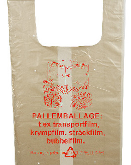 Genomskinlig plastpåse med röda illustrationer av packade pallar. Text: "PALLEMBALLAGE: t ex transportfilm, krympfilm, sträckfilm, bubbelfilm."