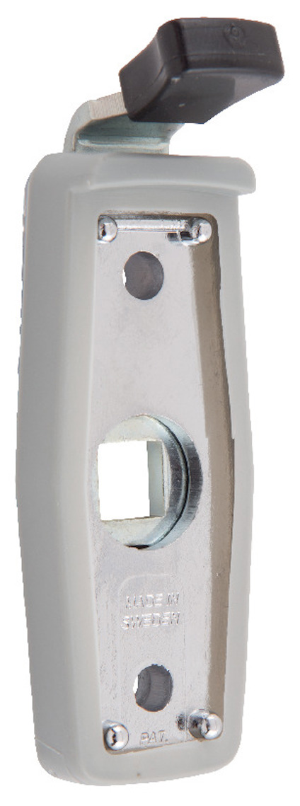 Handtagsspärr i metall och plast med rektangulär form och handtag i ovankant.