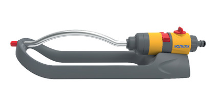 Spridare med grå och gul plastkropp, metallisk rördel och ett munstycke med röd detalj.