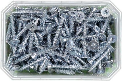 En plastlåda fylld med silverglänsande skruvar med stjärnformade skåror på huvudet.