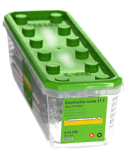 Plastförpackning med grönt lock, innehållande byggskruvar, märkta "Construction screw ET-T silver CorSeal".