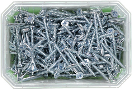Låda fylld med silverfärgade skruvar med stjärnformade skruvhuvuden.