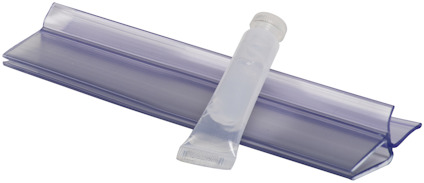Transparent tätlist och tub med smörjmedel.