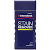 Förpackning med "International Stain Remover", 500 ml. Marinblå etikett med gul och vit text.