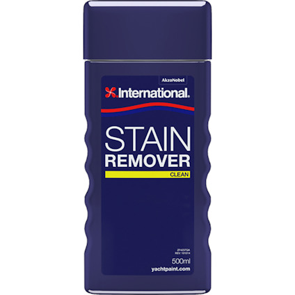 Förpackning med "International Stain Remover", 500 ml. Marinblå etikett med gul och vit text.