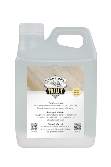 Klar plastdunk med etikett "Gammeldags Trälut" och instruktionstext på svenska och finska.