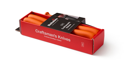 Orange hantverksknivar i röd förpackning med texten "Craftsman's Knives" och "3 knives included + holster".