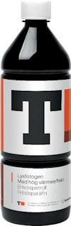 Flaska med etikett som visar ett "T" i svart och text: "Lystofogen Med hög värmeeffekt Erikospetroli Fritidsparafin".